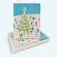 Mellow Monkey Holiday Cheer Skaters boxed greeting cards featuring a festive ice skating scene around a Christmas tree