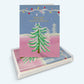 Mellow Monkey Holiday Spirit Tree greeting cards featuring a painted Christmas tree and festive string lights.
