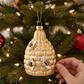 Mellow Monkey golden glass honey bee hive Christmas ornament with crystal-embellished bees hanging on a tree