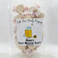 Mellow Monkey Honey Salt Water Taffy, creamy, golden candy individually wrapped in wax paper with red floral accents.