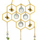 Mellow Monkey honeycomb suncatcher with gold bee charms and hanging iridescent crystals for rainbow light refraction.