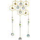 Mellow Monkey honeycomb suncatcher with gold bees, clear crystals, and green stone accents on gold chains.