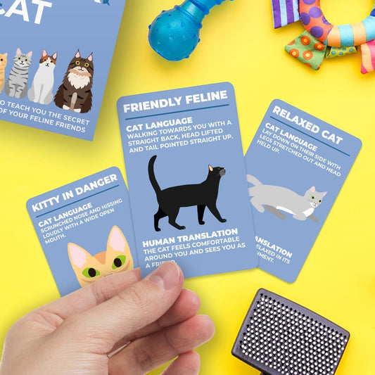 Mellow Monkey How To Speak Cat cards featuring illustrations and explanations of feline body language on blue cards.