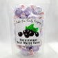 Mellow Monkey Huckleberry Salt Water Taffy, 6-oz bag of individually wrapped purple and white taffy candies with a label featuring black huckleberries and green leaves.