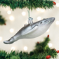 Mellow Monkey hand-blown glass humpback whale ornament in silver with glitter accents hanging on a Christmas tree