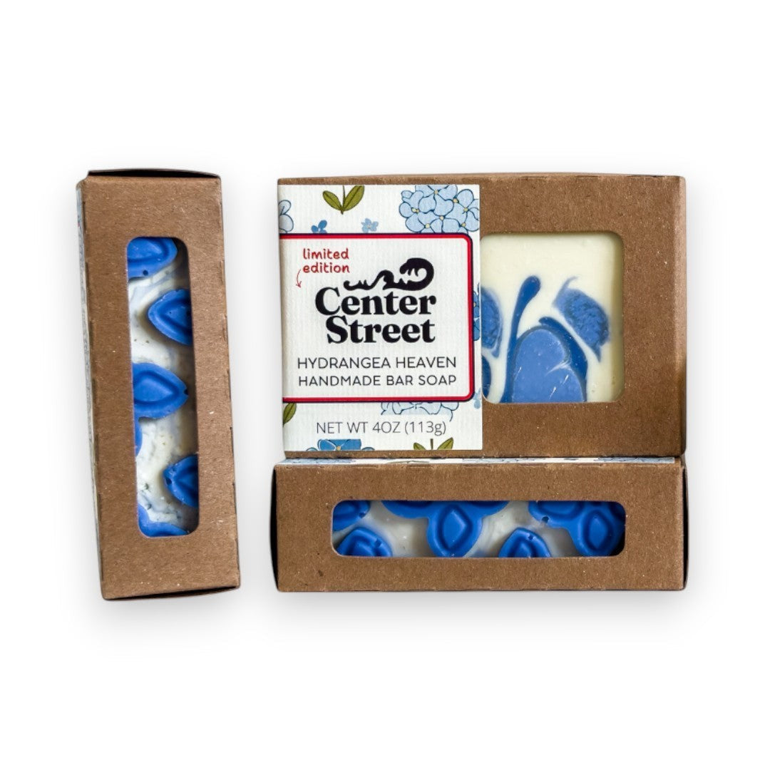 Mellow Monkey Hydrangea Heaven handmade soap bar with blue floral design and white swirls, 4oz.
