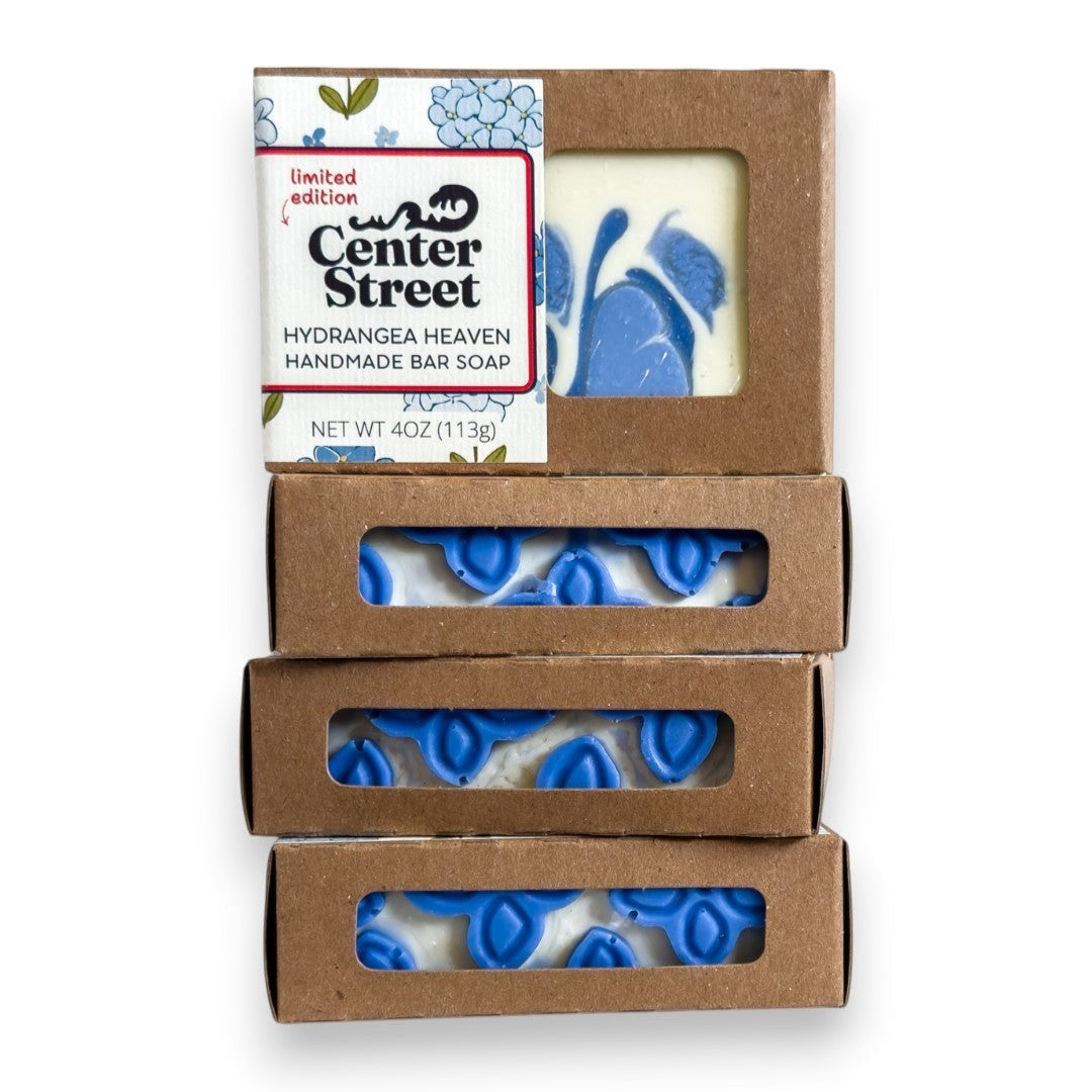 Mellow Monkey Hydrangea Heaven handmade soap bar with blue floral design, 4oz, in eco-friendly packaging.