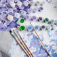 Mellow Monkey Happily Hydrangea paint by number kit with numbered acrylic paint pots, brushes, and floral canvas.