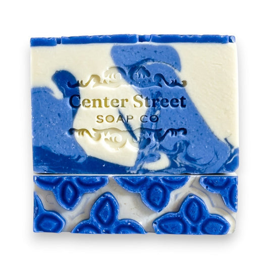 Mellow Monkey Hydrangea Heaven handmade soap bar, 4-oz, with blue and white swirls and floral embossed pattern.