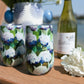 Mellow Monkey 16oz stainless steel wine tumbler with a blue and white coastal hydrangea floral print on a wooden table