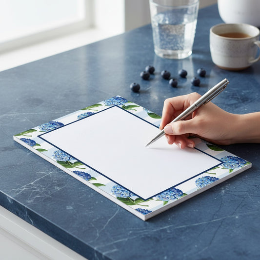 Mellow Monkey Hydrangeas Stripe Notepad, 5x7-in, featuring blue hydrangeas and light blue stripes.