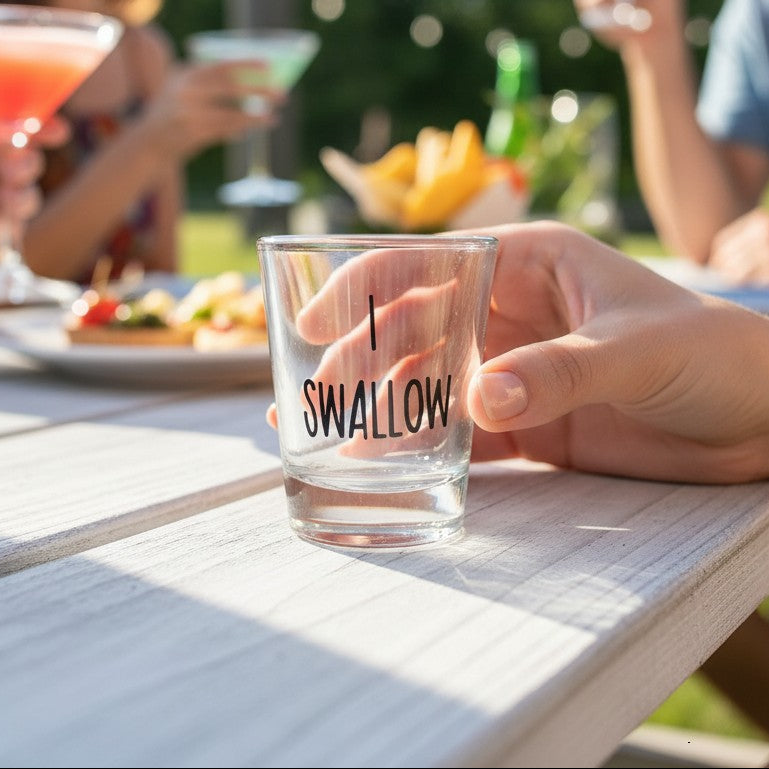 Mellow Monkey I Swallow shot glass, clear glass with black text, 1.5 oz capacity, ideal for parties and gifts.