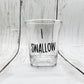 Mellow Monkey I Swallow shot glass, clear glass with black text, 1.5 oz capacity, perfect for parties or gifts.