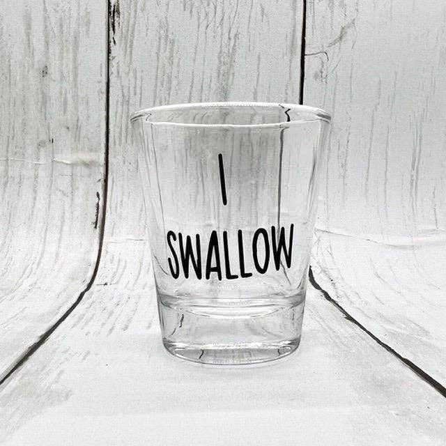 Mellow Monkey I Swallow shot glass, clear glass with black text, 1.5 oz capacity, perfect for parties or gifts.