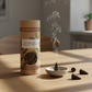 Mellow Monkey English Oak and Black Currant incense cones with a small ceramic holder on a wooden table