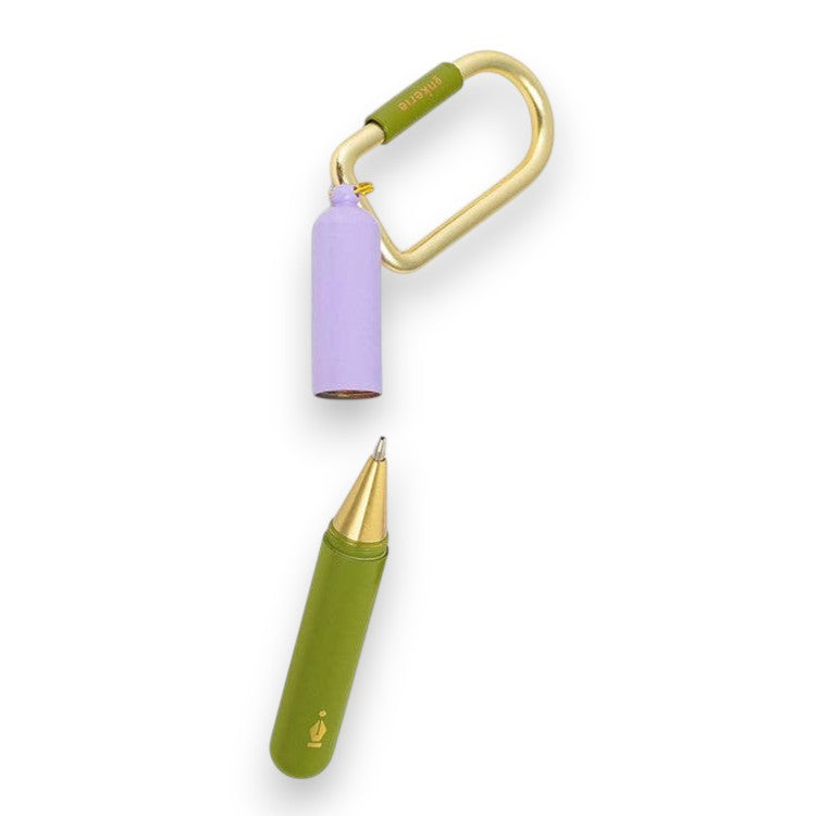 Mellow Monkey Inkerie keychain pen with a lavender cap, olive green body, and gold carabiner on a white background.