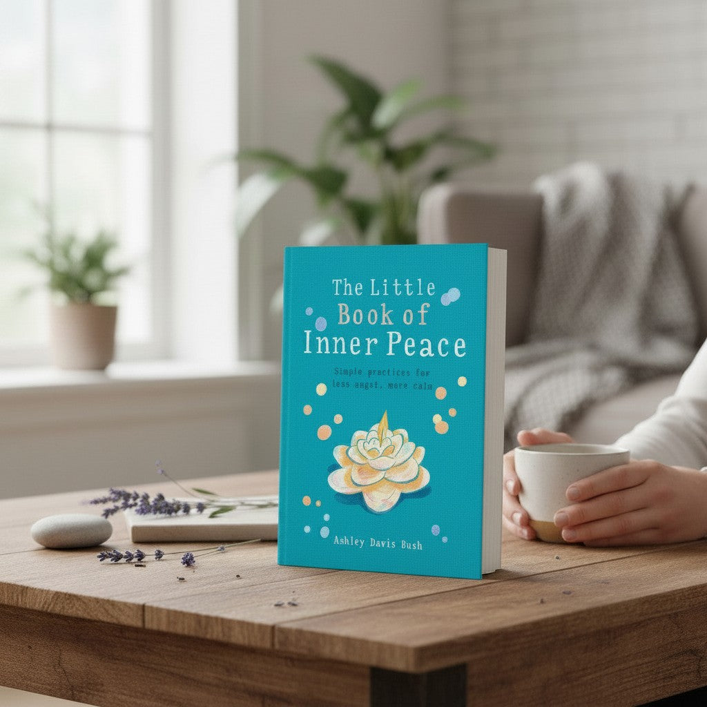 Mellow Monkey Little Book of Inner Peace paperback with teal cover and floral illustration on a wooden table