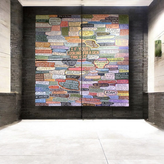 Mellow Monkey 6-ft gallery wrap wall art featuring colourful inspirational quotes on a dark brick wall background.