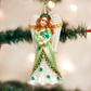 Mellow Monkey Irish Angel blown glass Christmas ornament with green shamrock dress and white wings on a tree