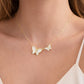 Mellow Monkey 18k gold vermeil necklace with two ivory mother-of-pearl butterflies, one accented with cubic zirconia.