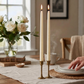 Mellow Monkey set of two 12.5-inch ivory flameless taper candles with realistic glowing flames on a dining table