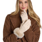 Mellow Monkey ivory knit gloves with soft faux fur cuffs worn by a woman in a brown textured coat