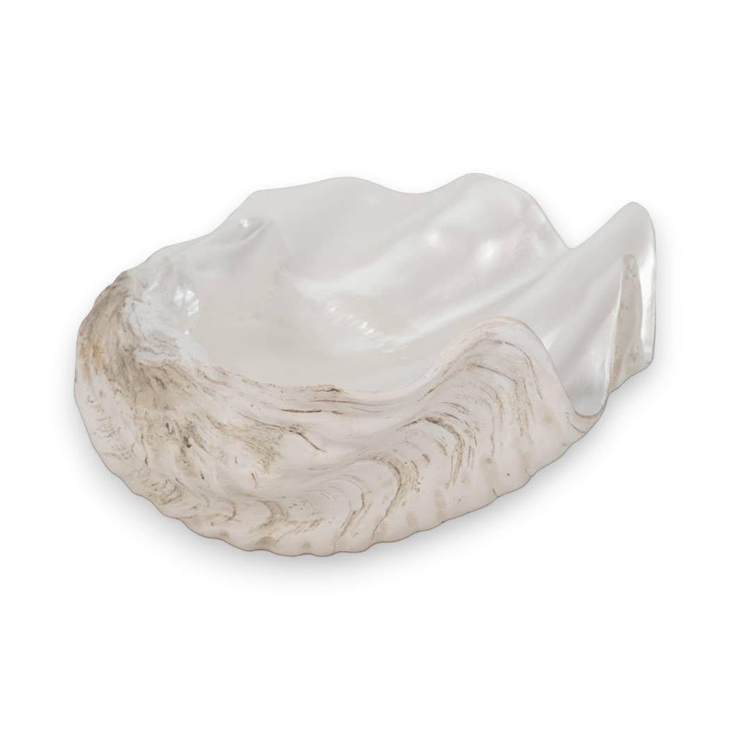 Mellow Monkey ivory and tan resin decorative bowl with a coastal shell-inspired wave design for tabletop display.