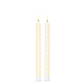 Mellow Monkey set of two 10.5-inch ivory twist taper flameless candles with a realistic warm LED glow.