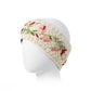 Mellow Monkey ivory hand-knit wool headband with delicate floral embroidery and a cozy fleece lining on a mannequin