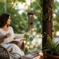 Mellow Monkey mini healing wind chime with jade stones and aluminum tubes hanging on a serene outdoor patio.