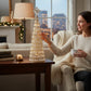 Mellow Monkey 16.5-inch jewel cone tree with crystal-like teardrop accents on a wooden table in a cozy living room