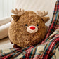 Mellow Monkey Jingle the Reindeer large round brown plush toy with a red nose and soft antlers on a plaid blanket.