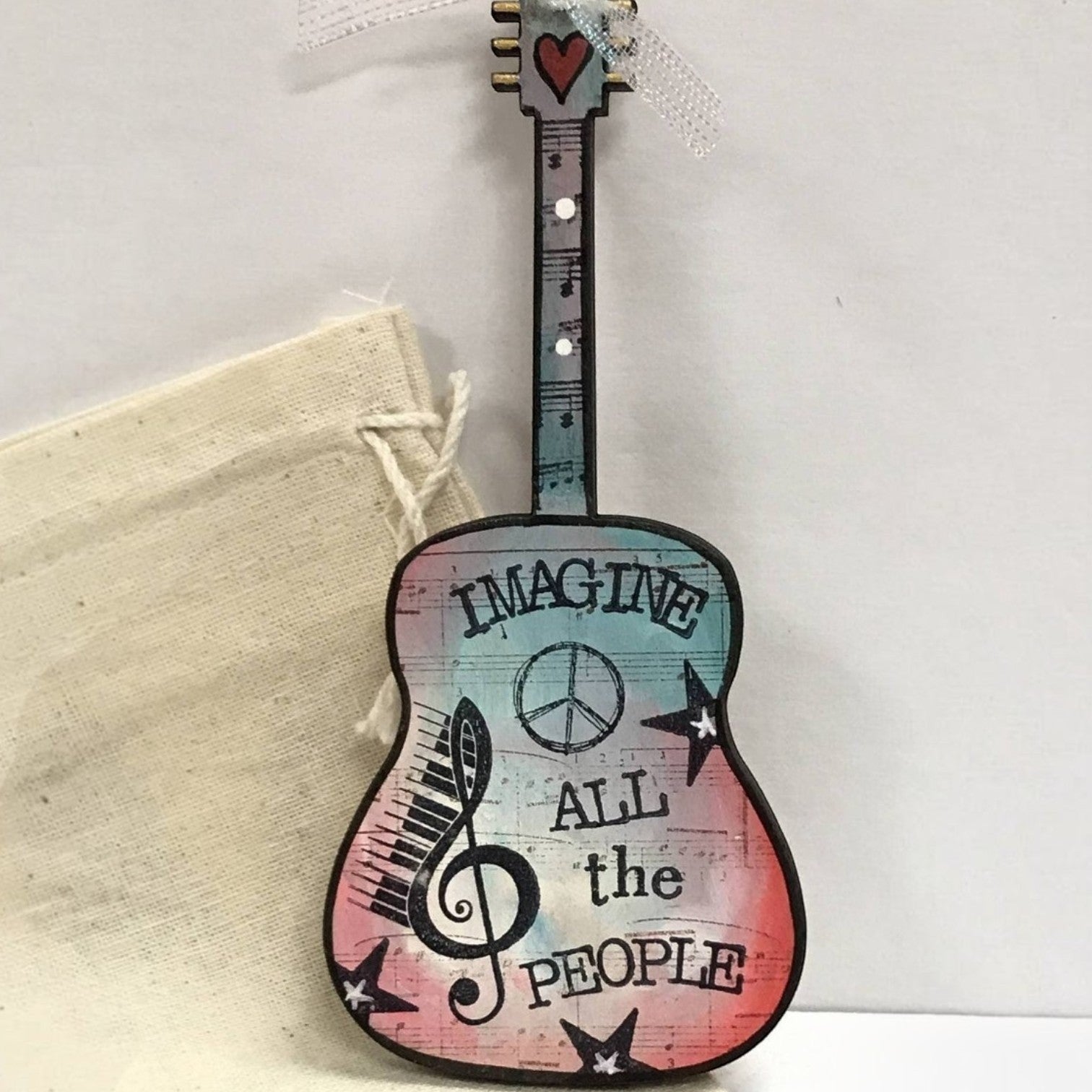 Mellow Monkey hand-painted wooden John Lennon Imagine guitar ornament with vibrant acrylics and ribbon hanger.