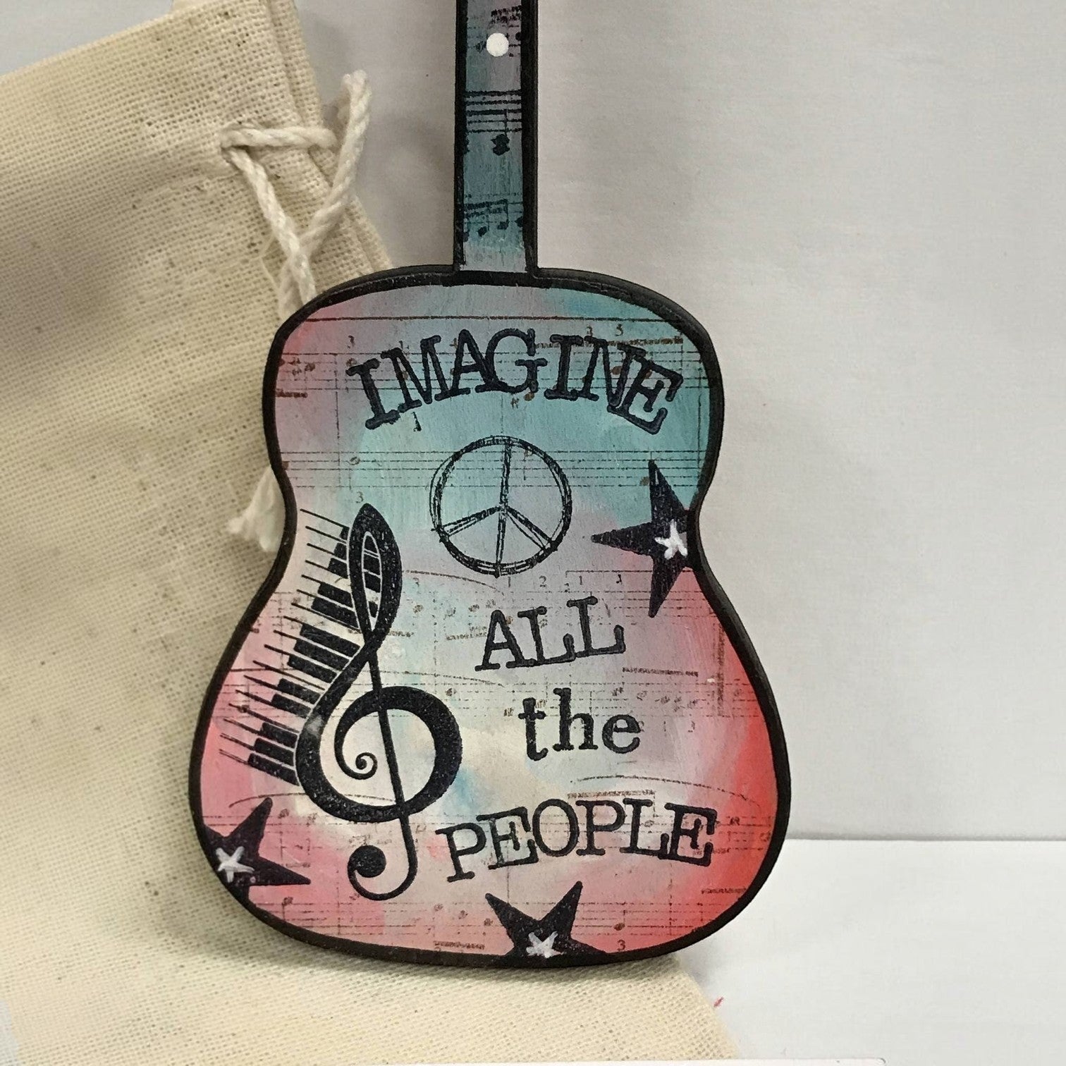 Mellow Monkey hand-painted wooden John Lennon Imagine guitar ornament with musical notes and peace sign design.