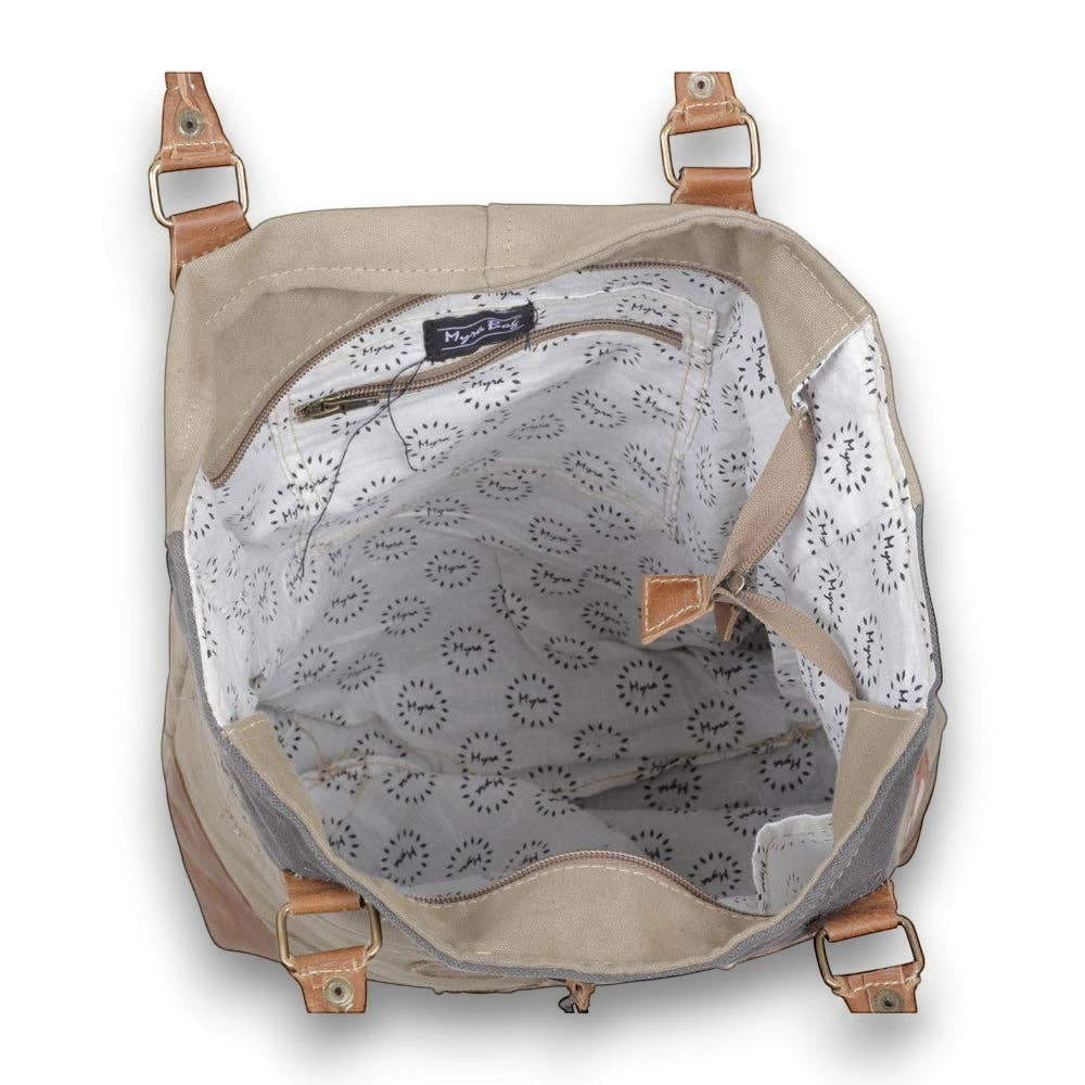 Mellow Monkey Quirky hues tote bag featuring organic jute, canvas, and leather accents with a patterned interior lining.