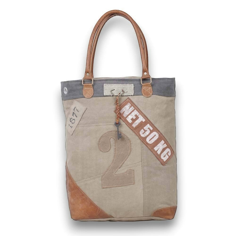 Mellow Monkey Quirky hues tote bag made from organic jute and leather with vintage-style typography and brown handles.