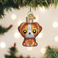 Mellow Monkey Mini Kawaii Dog blown glass holiday ornament, 2-in. Features large black eyes, floppy ears, and a red collar with a green gem.