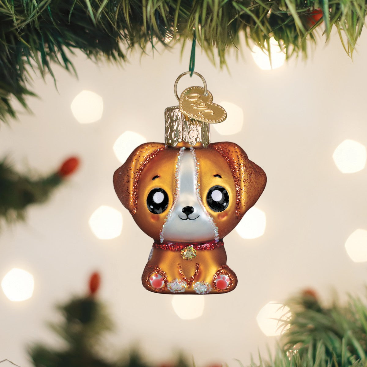 Mellow Monkey Mini Kawaii Dog blown glass holiday ornament, 2-in. Features large black eyes, floppy ears, and a red collar with a green gem.