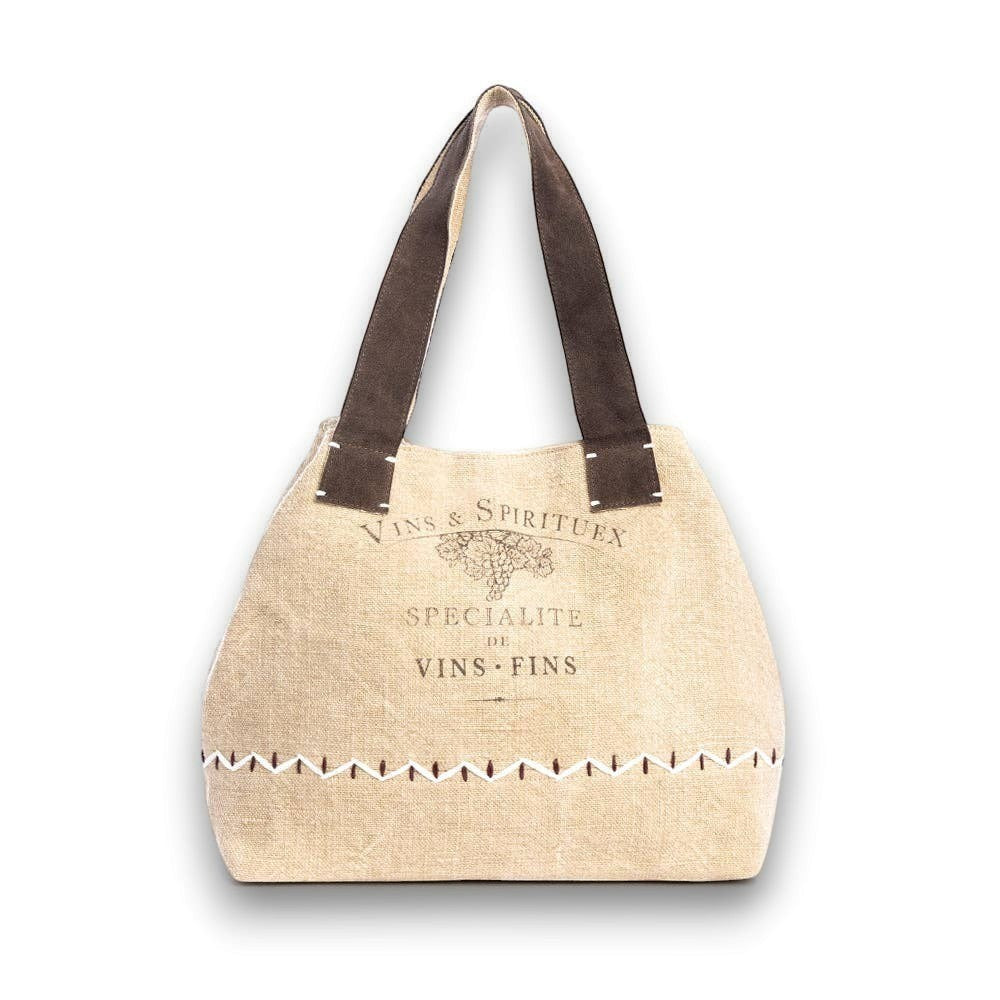 Mellow Monkey Kendlie Mesa tote bag in wheat upcycled canvas with chocolate suede handles and decorative stitching.