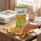 Mellow Monkey Jody's Old Fashioned Kettle Corn bag on a wooden table with a hand reaching for the popcorn snack