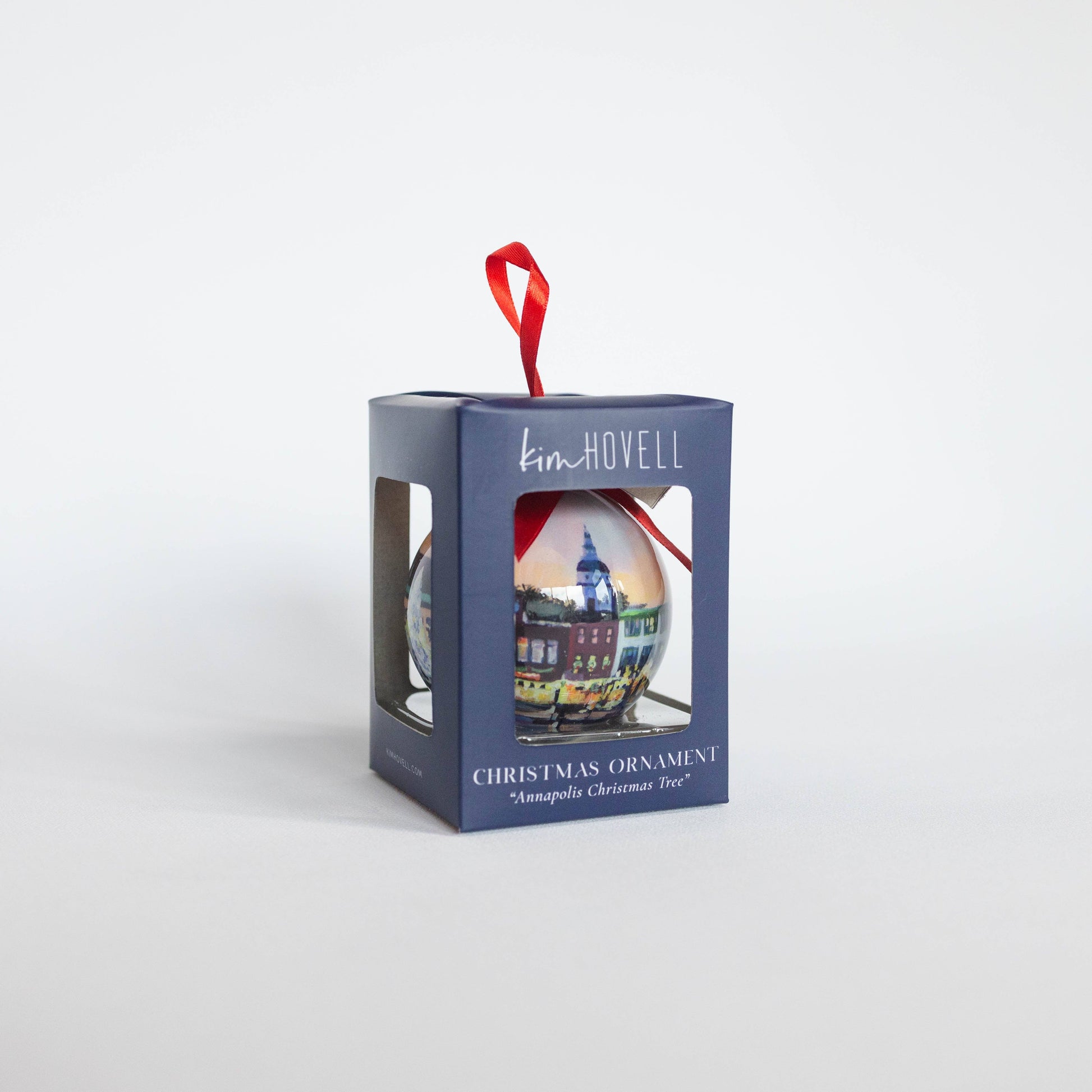Mellow Monkey decoupage Christmas ornament featuring Kim Hovell Downtown Christmas artwork in a display box