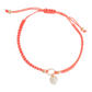 Mellow Monkey Kitt adjustable coral braided bracelet with a sparkling heart charm and gold-tone accents.
