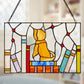 Mellow Monkey stained glass window panel featuring a yellow kitten sitting on a stack of colorful books