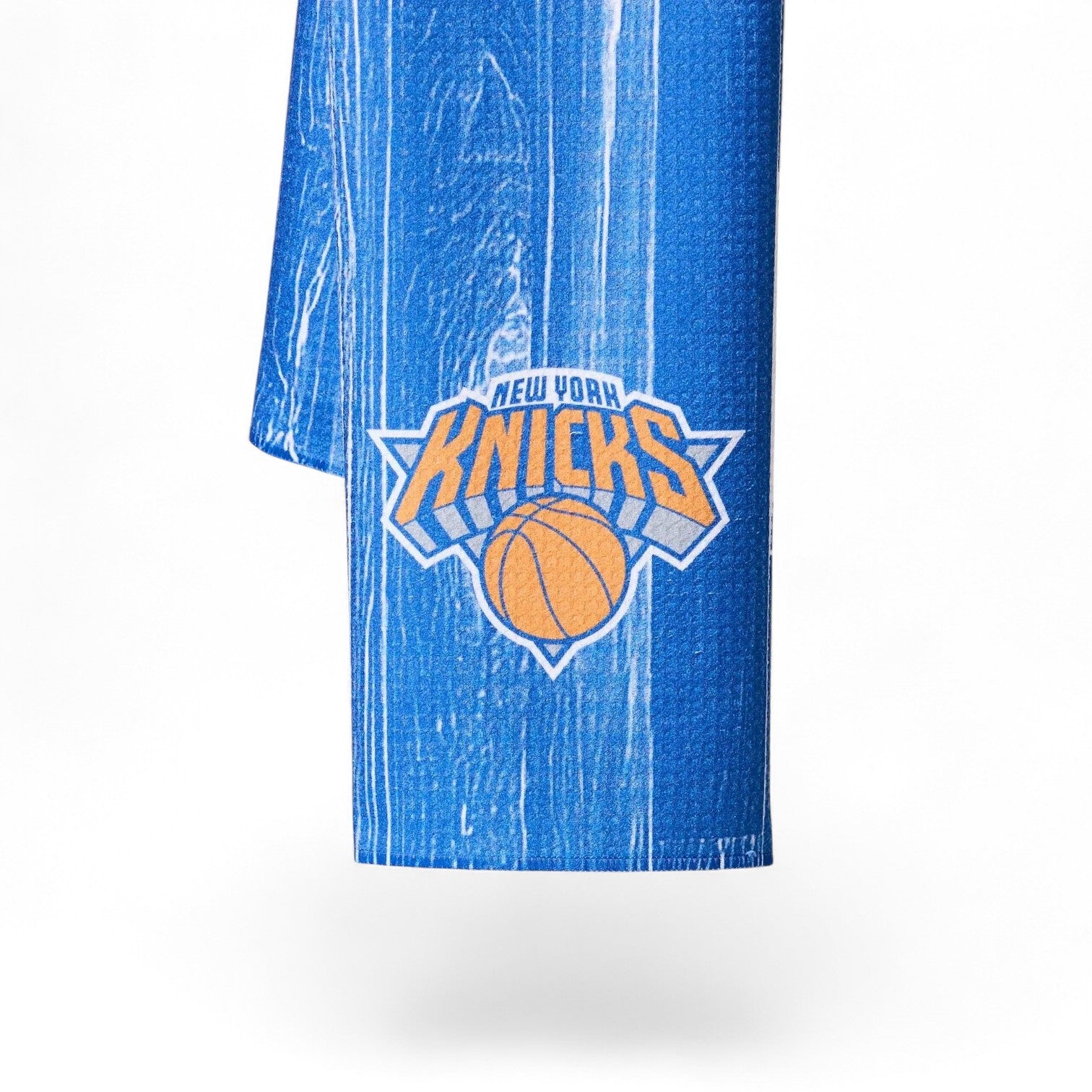 Mellow Monkey New York Knicks blue tea towel with wood grain print and official NBA team logo