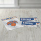 Mellow Monkey New York Knicks vinyl decal and NBA Finals ticket stubs on a wooden table.