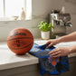 Mellow Monkey Knicks floral tea towel featuring team logo and blue rose print on a kitchen counter with a basketball.