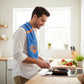 Mellow Monkey Knicks Zone tea towel draped over a man's shoulder while cooking in a bright modern kitchen