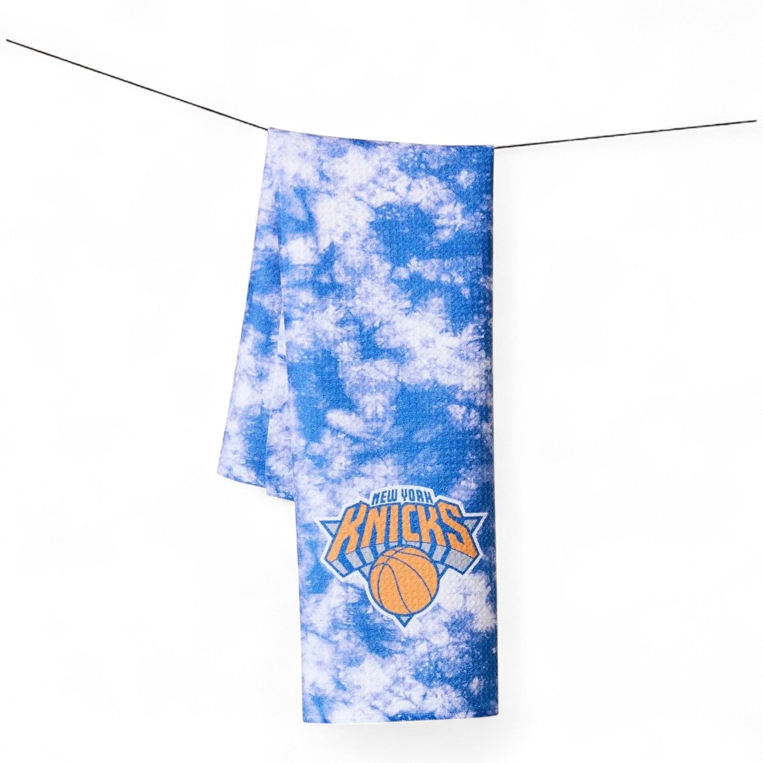 Mellow Monkey Knicks Flash tea towel featuring a blue and white tie-dye pattern with the New York Knicks logo.