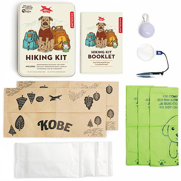 Mellow Monkey Kobe Dog Hiking Kit with travel essentials including poop bags, water bowls, light, and guide booklet.