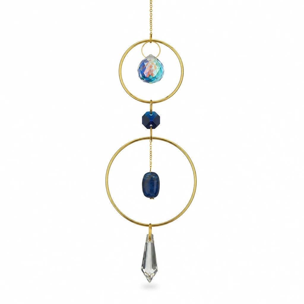 Mellow Monkey Lapiz healing ornament suncatcher with blue gemstones and crystals suspended in gold bronze rings.